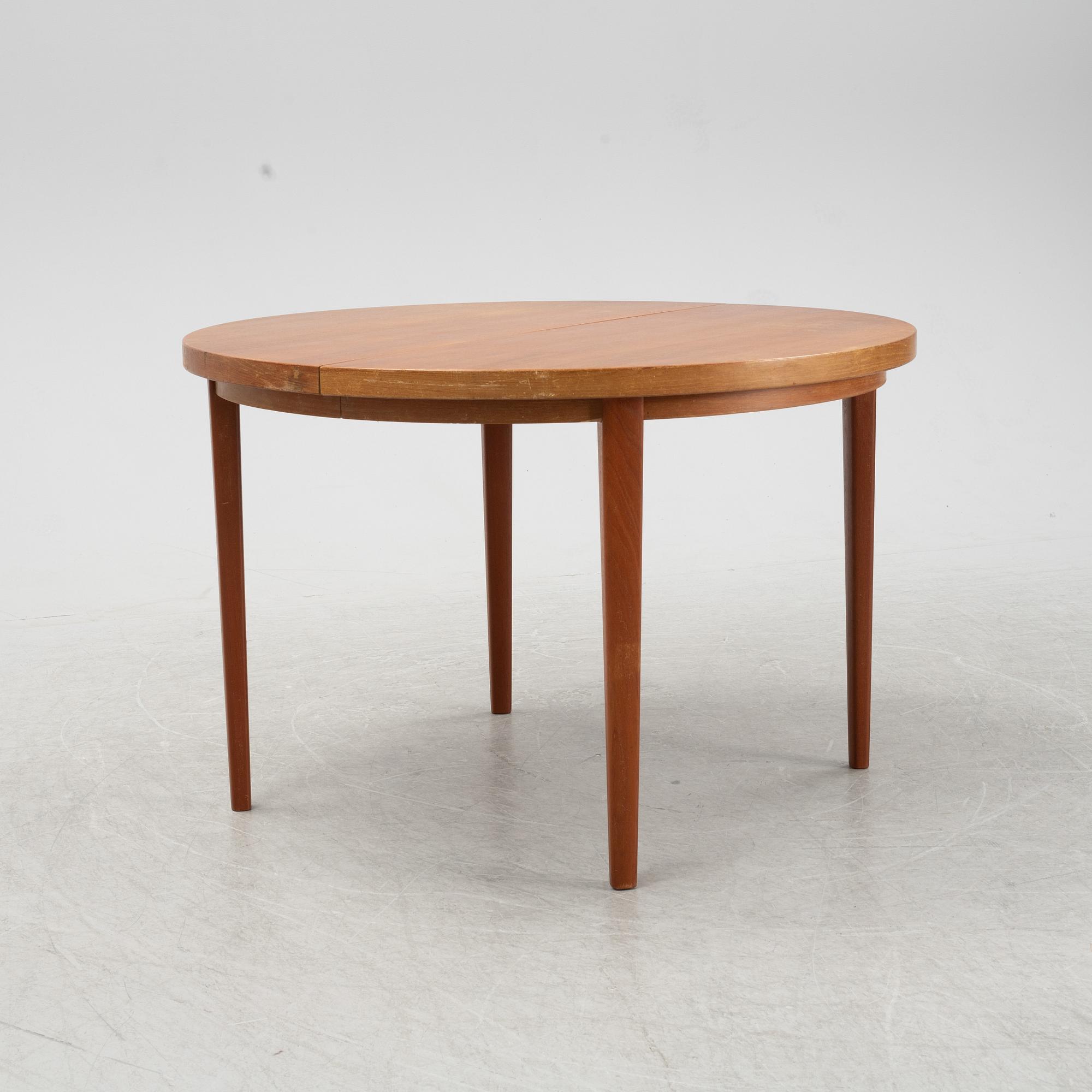 A five-piece teak and oak dining suite, second half of the 20th Century.