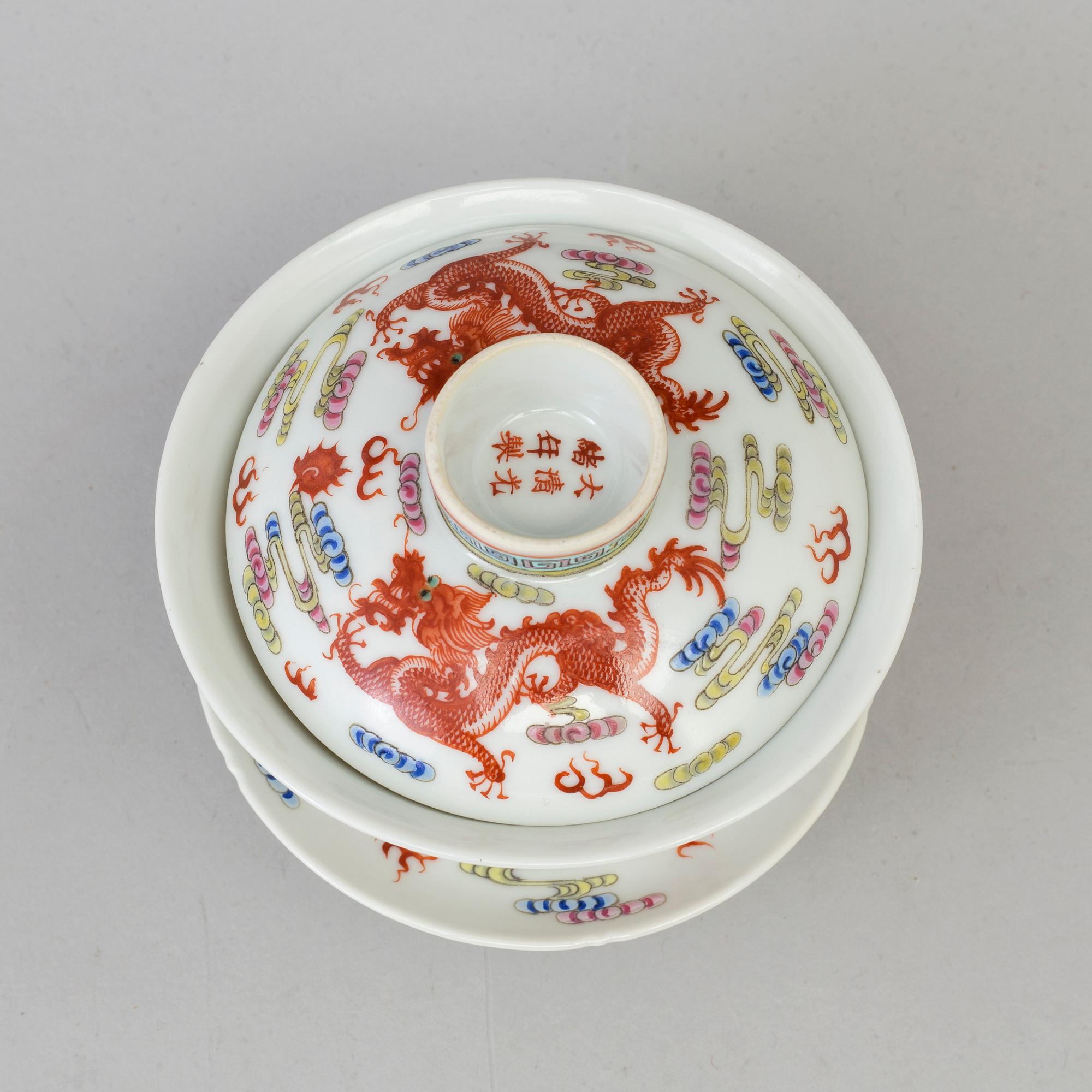 A Chinese 20th century famille rose porcelain cup with cover and dish, with Guangxus six character mark.