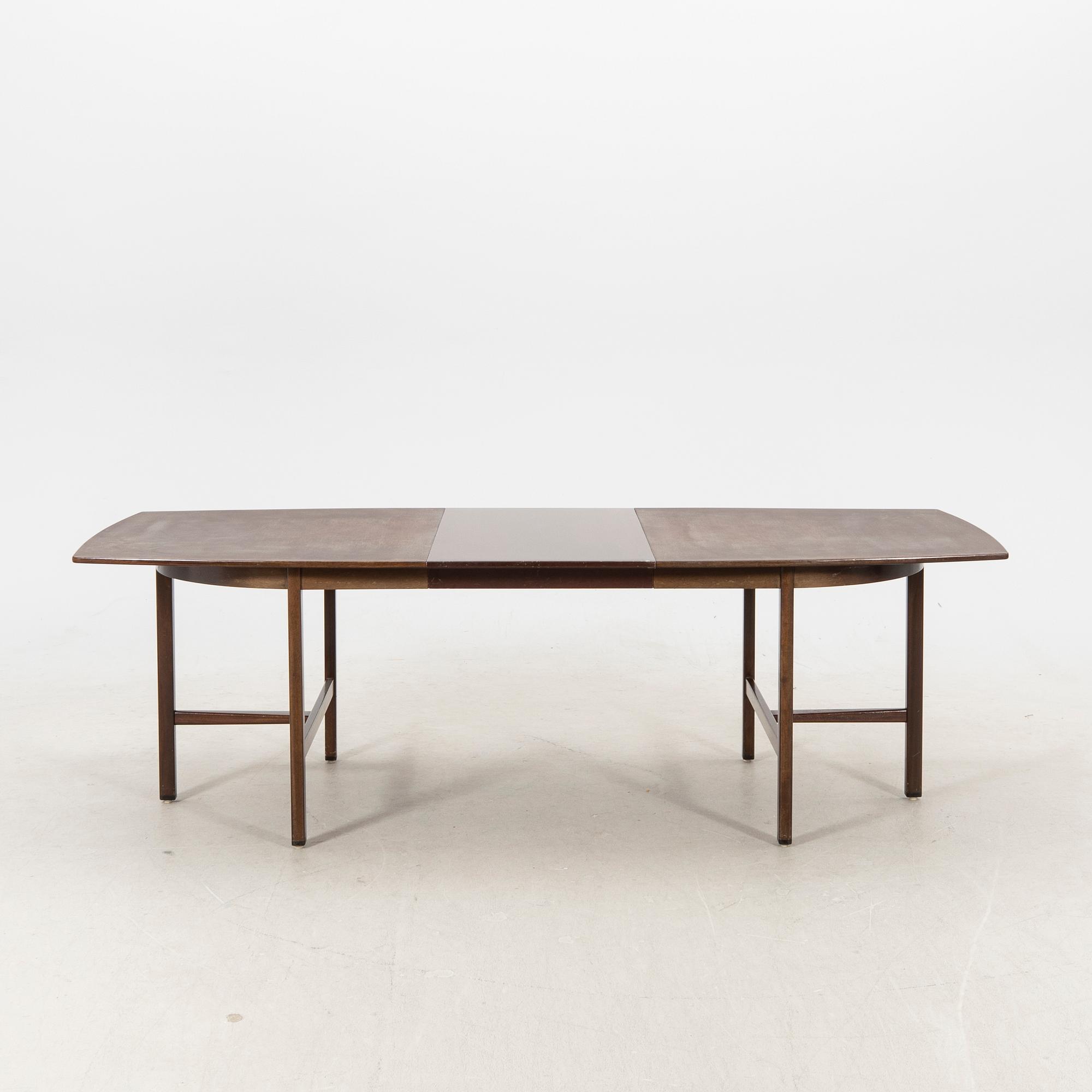 A table and four chairs in lacquered mahogany by David Rosén, "Triva-diné", middle of the 20th century.