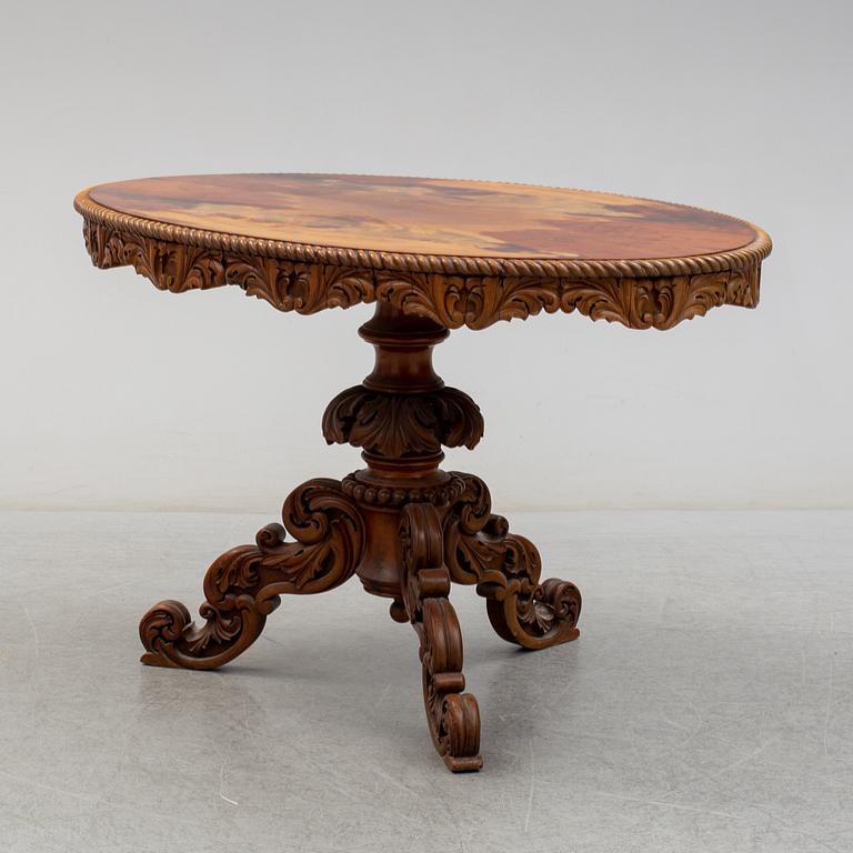 A second half of the 19th century mahogany veneered table.