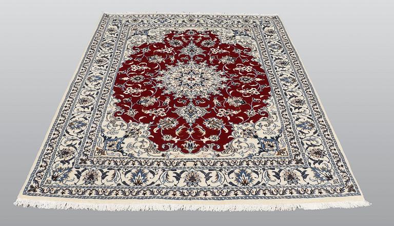 A rug, Nain part silk, ca 208 x 149 cm.