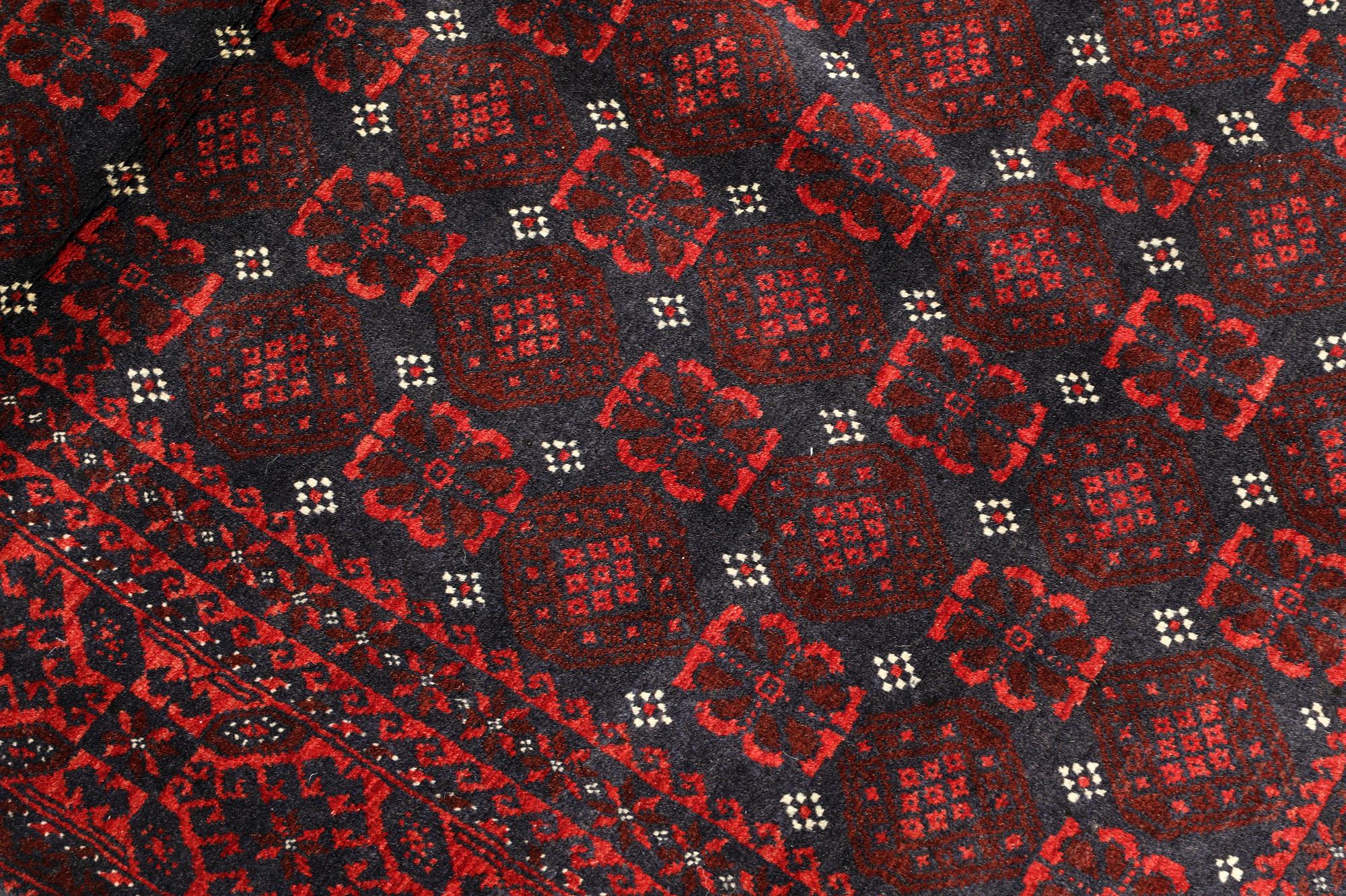 A Beluch rug, c. 203 x 117 cm.