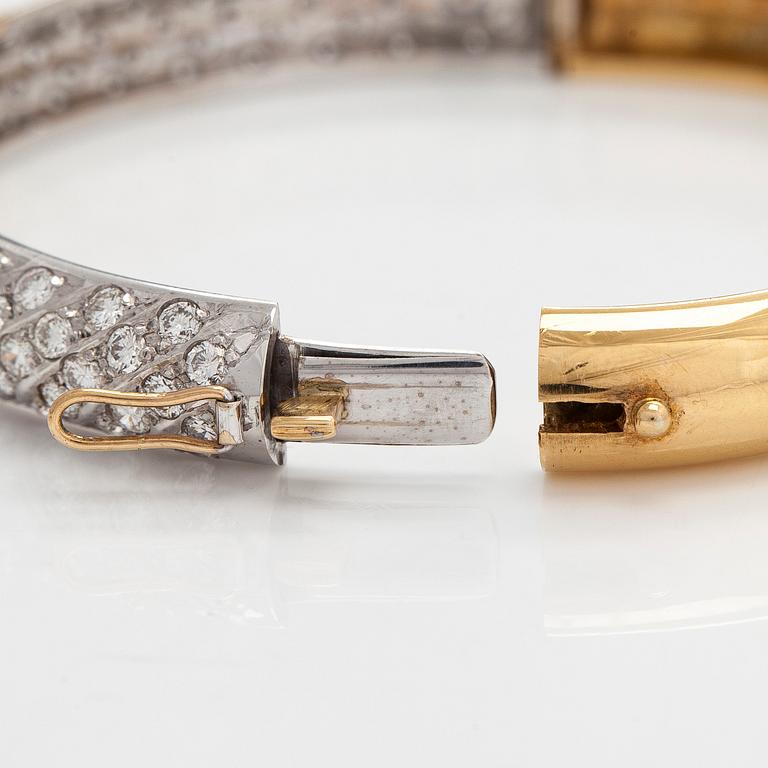 Tillander, armring, 18K guld med briljantslipade diamanter totalt ca 6.62 ct, Helsingfors 1986.