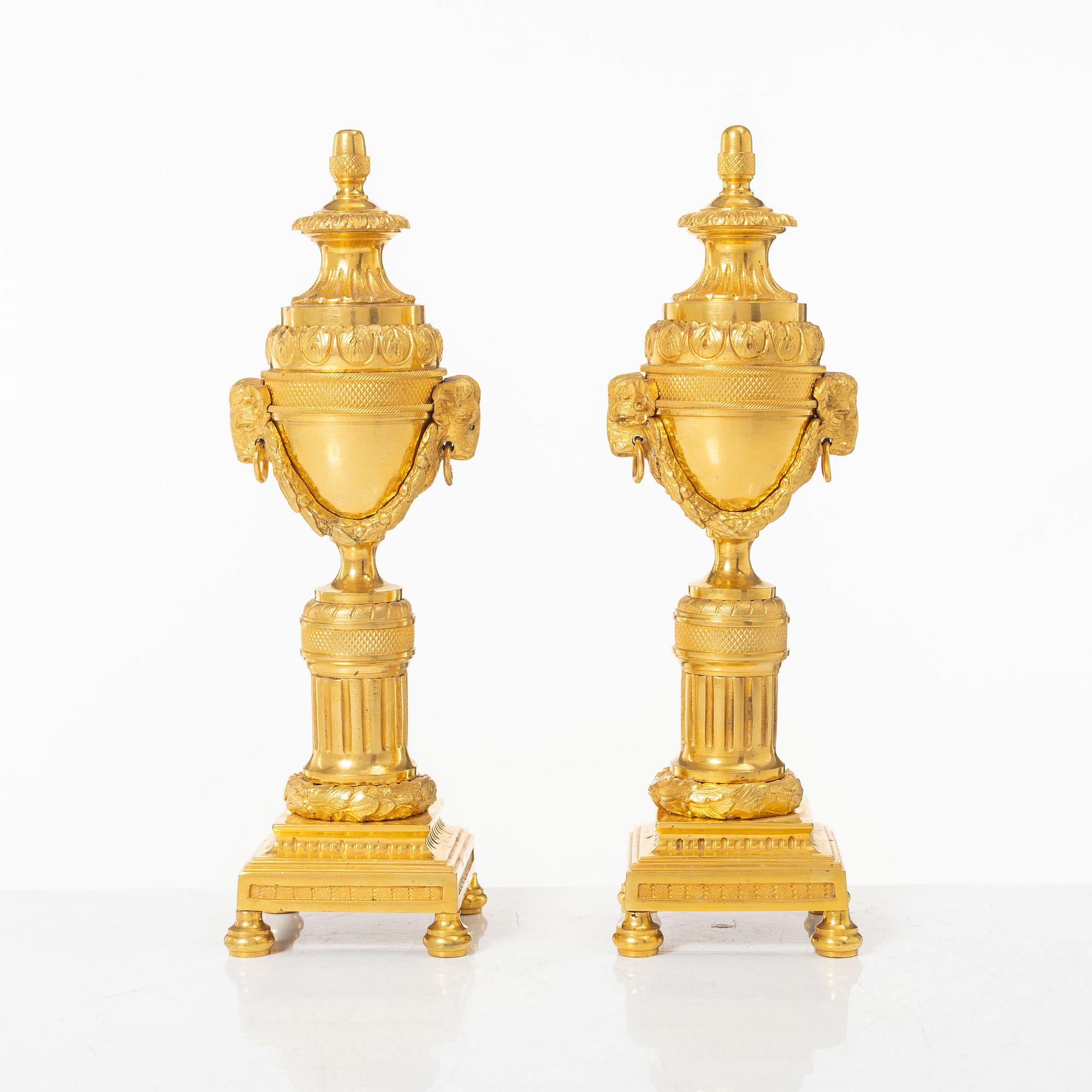 A pair of French Louis XVI style gilt-bronze casolettes, later part 18th century.