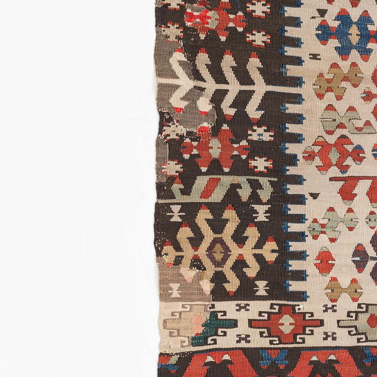 An antique Anatolian kilim, ca 324 x 169 cm.