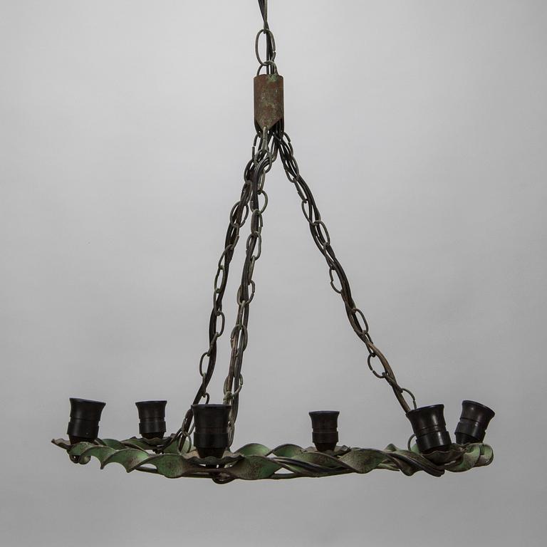 TAKAMPEL, smidesjärn, 1900-talets första hälft. Höjd 95 cm.