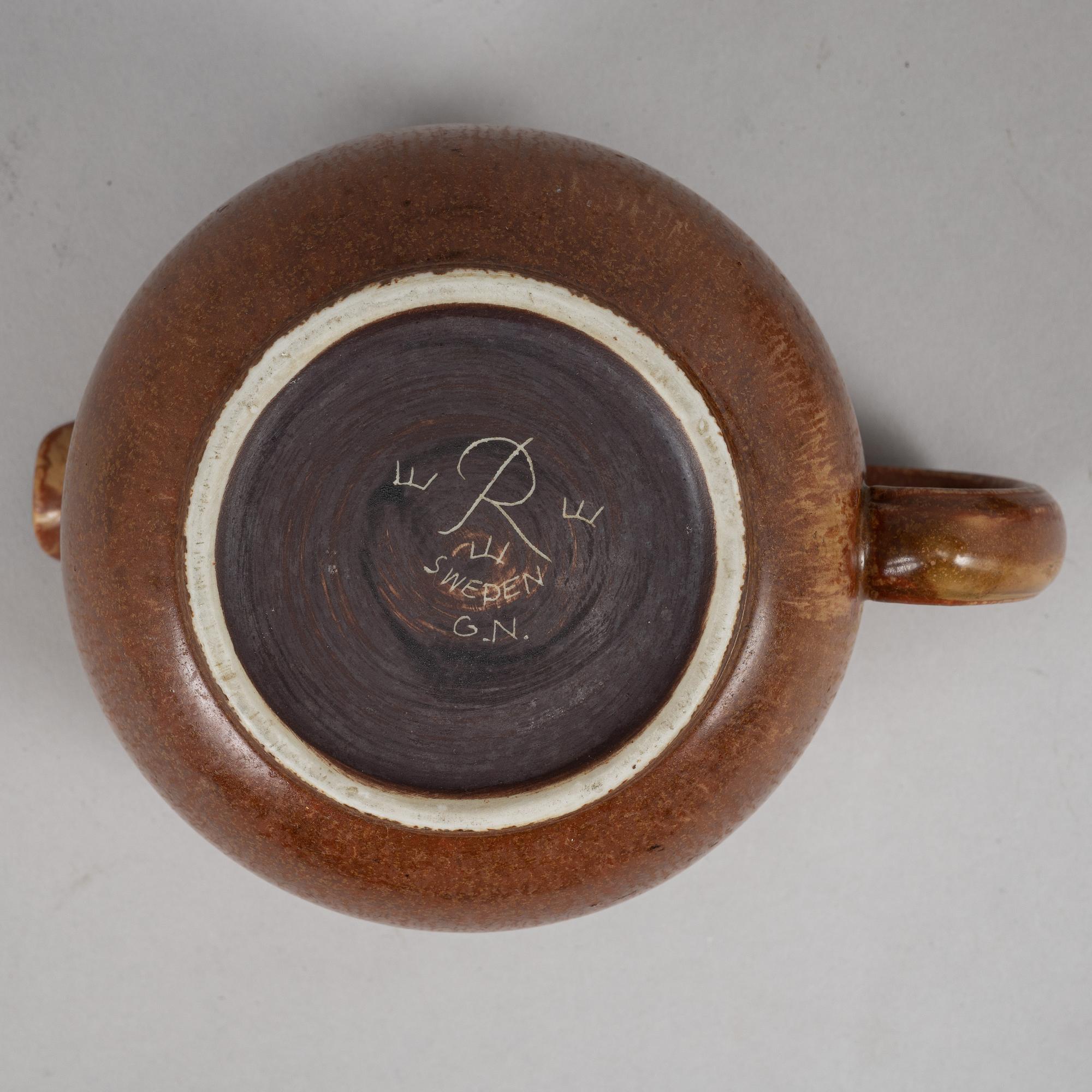 Tea pot, two bowls, two creamers, and a vase by Gunnar Nylund, stoneware, Rörstrand.
