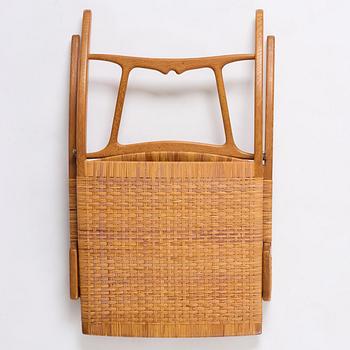 Hans J. Wegner, a foldable easy chair model 512, Johannes Hansen, Copenhagen, 1950s-60s.