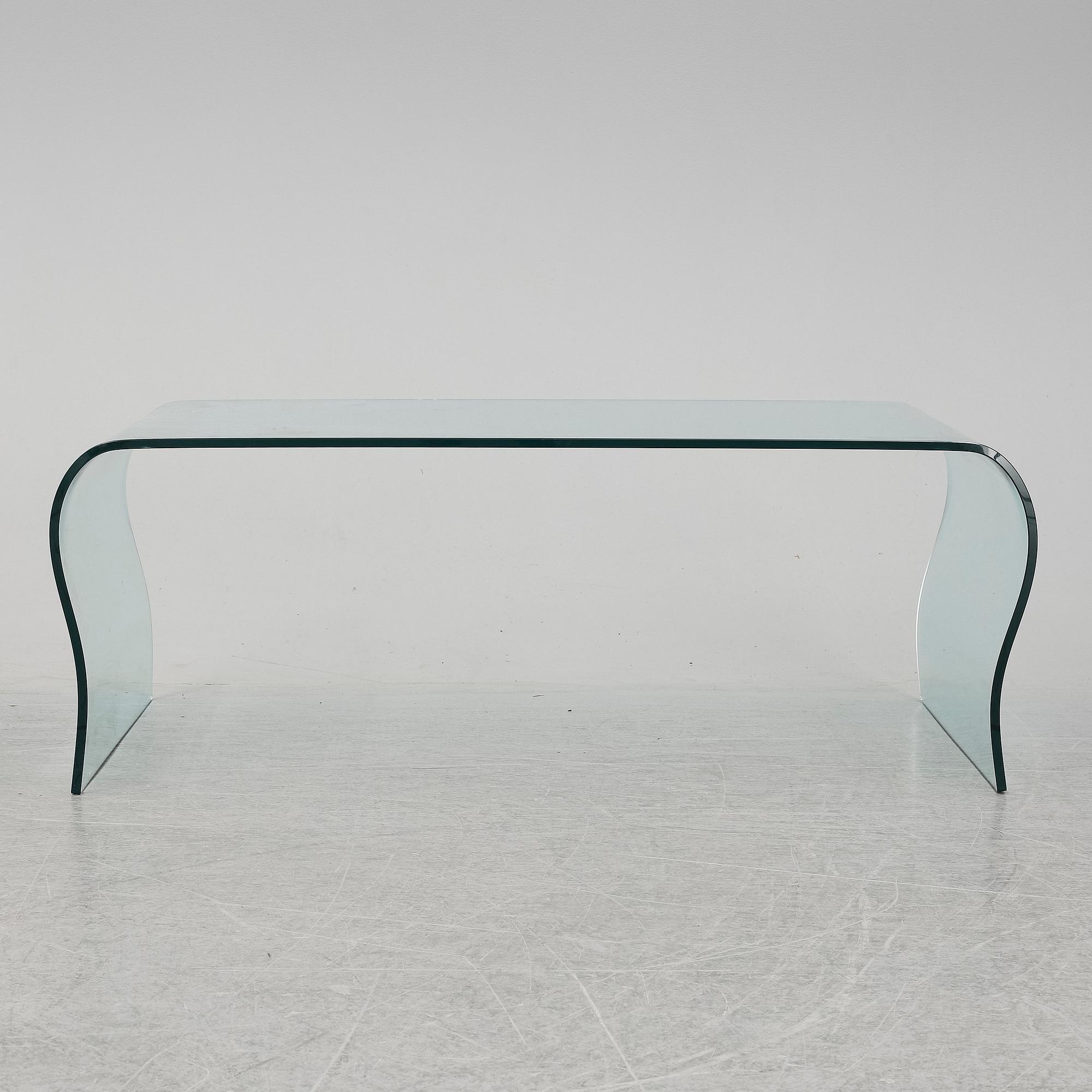 A mid 20th Century glass coffee table.