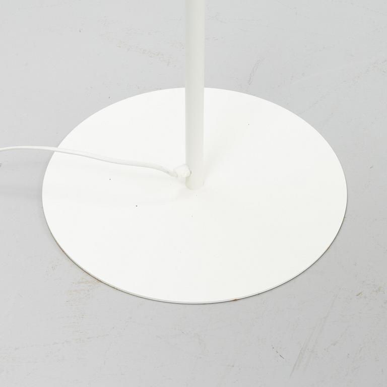 A white metal floor light, Luxus, Vittsjö.