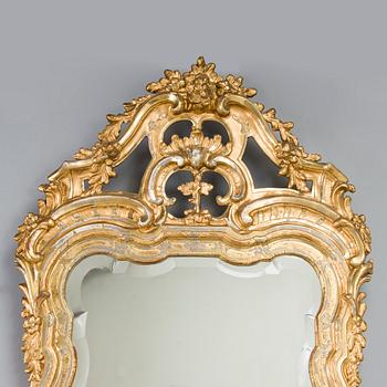 Johan Åkerblad, a giltwood Rococo mirror, signed and dated in Stockholm 1776.