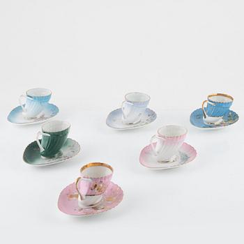 Twelve porcelain coffee cups with saucers, Kuznetsov, Russia, early 20th Century.