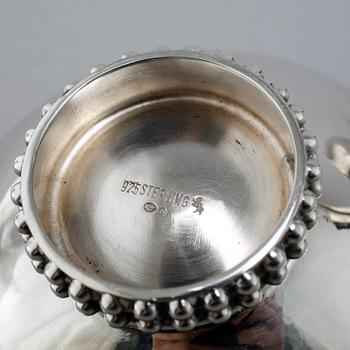A silver coffee set of four pieces from the middle of the 20th century.