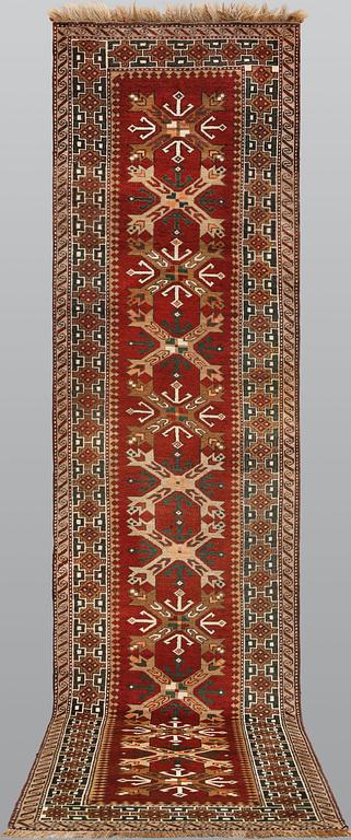 A semi-antique Anatolian carpet, c. 390 x 94 cm.