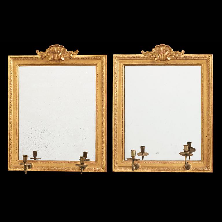 A pair of Gustavian two-light girandole mirros, one dated 1784.
