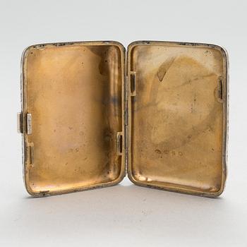 An English sterling silver cigarette case, maker's mark William M. Hayes, of Birmingham, 1896.