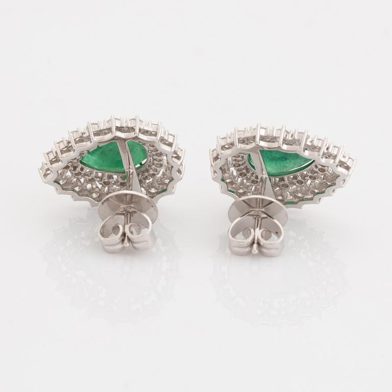 Pear shaped emeralds and brilliant cut diamond earrings.