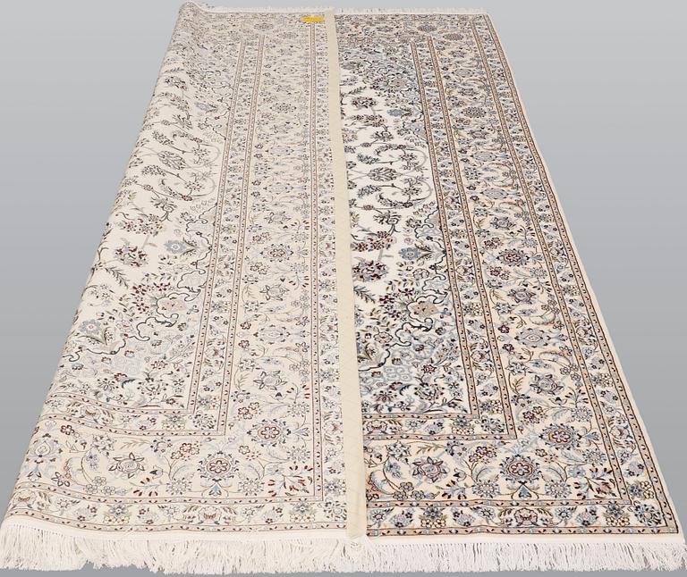 A part silk Nain carpet, c. 6LAA, ca. 310 x 209 cm.