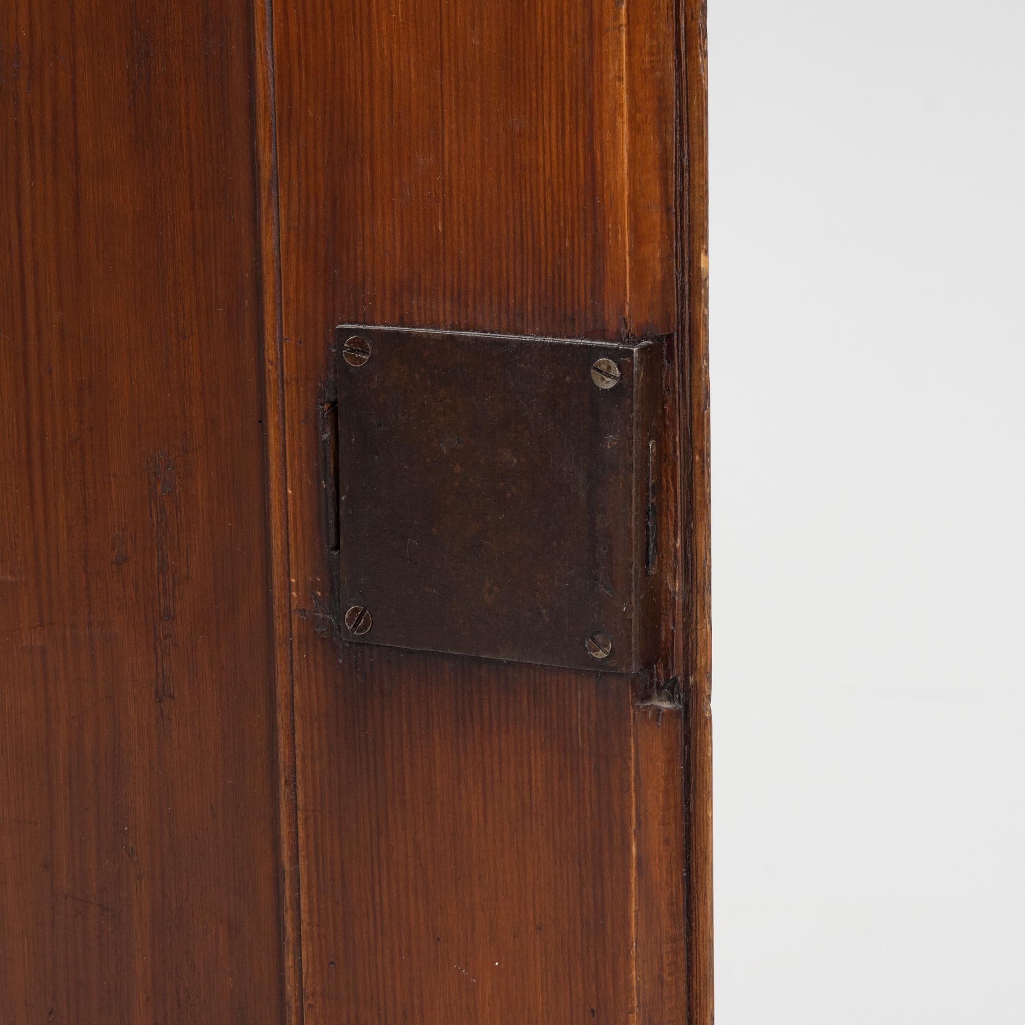 A Gustavian style pinewood corner cupboard, 19th Century.