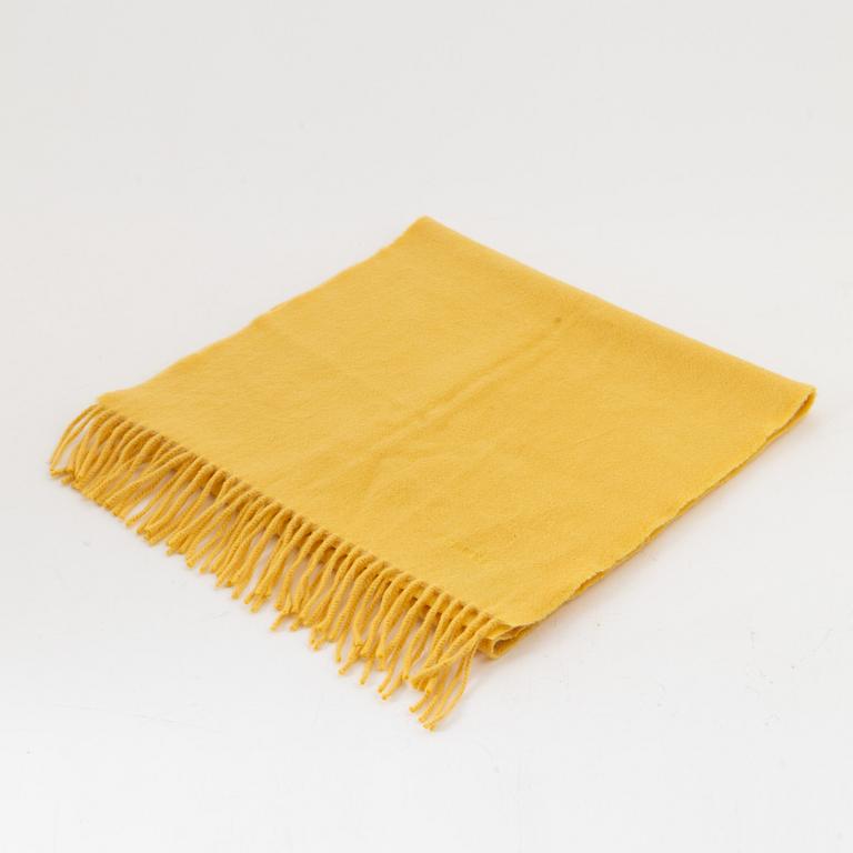 Hermès, a yellow cashmere scarf.