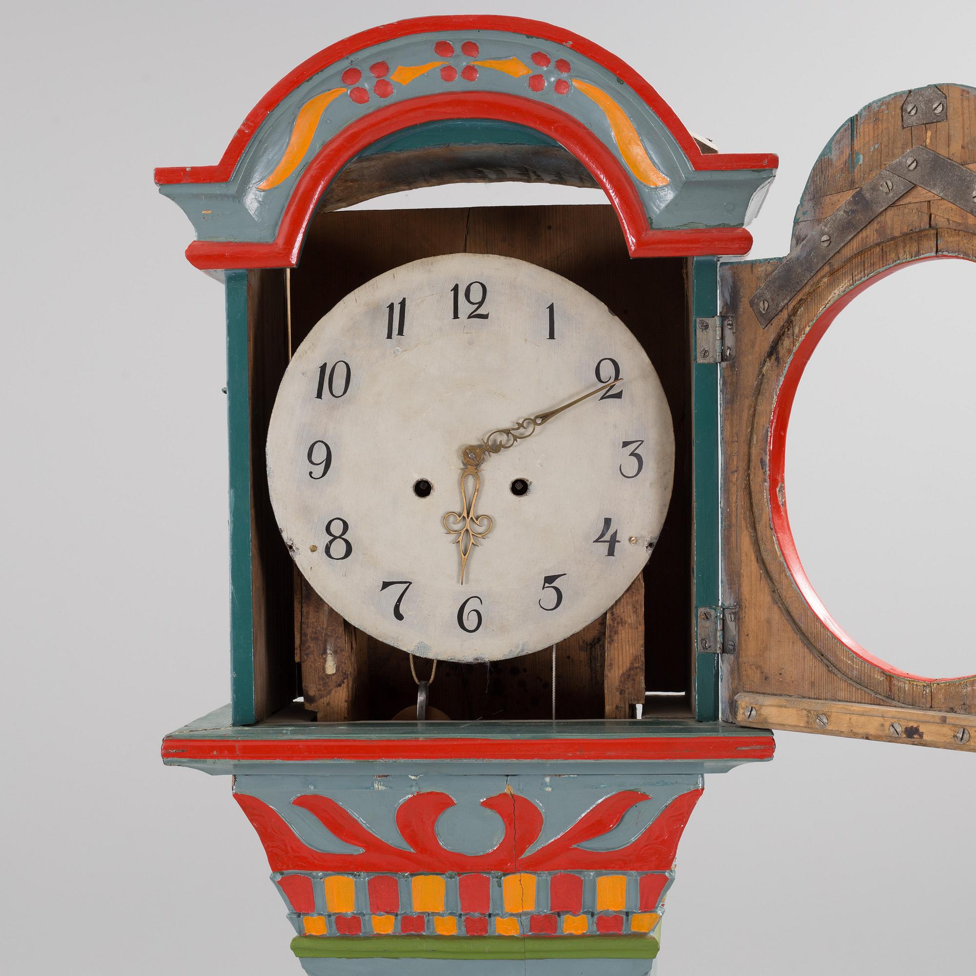 a painted grandfather-clock from the first half of the 19th century.