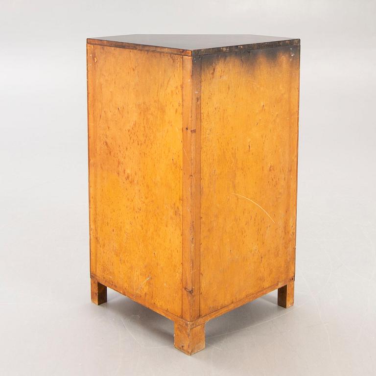 A 1930s birch corner cabinet.