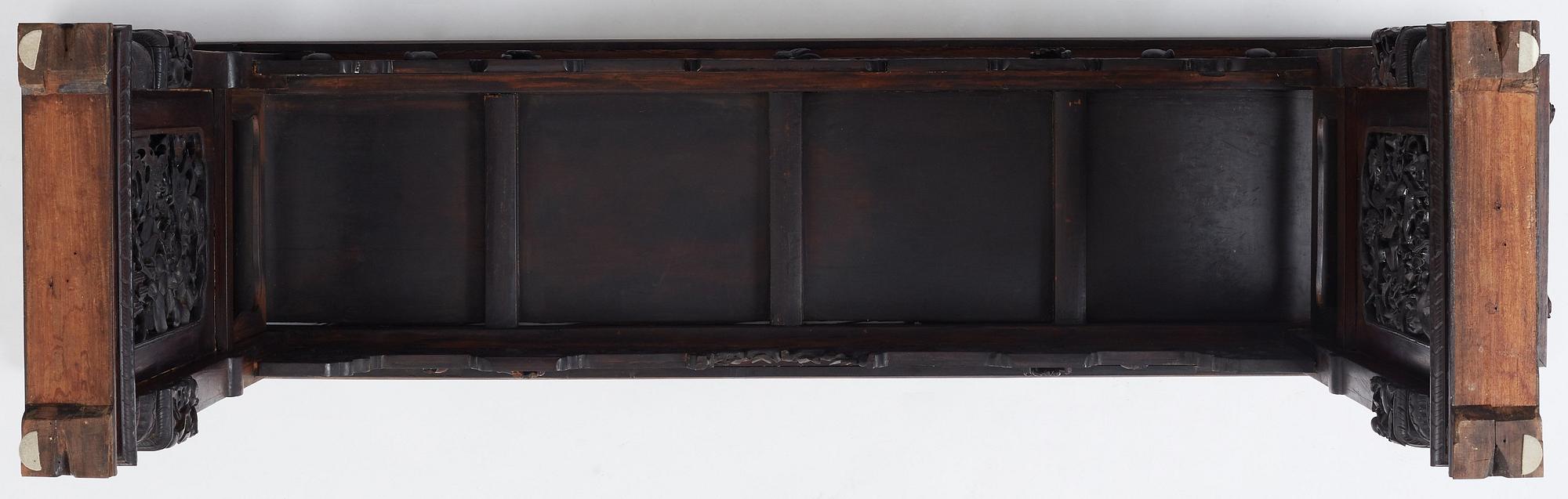 A massive zitan recessed-leg long table 'Jiaotousun Qiotouan', Qing dynasty, 19th century.