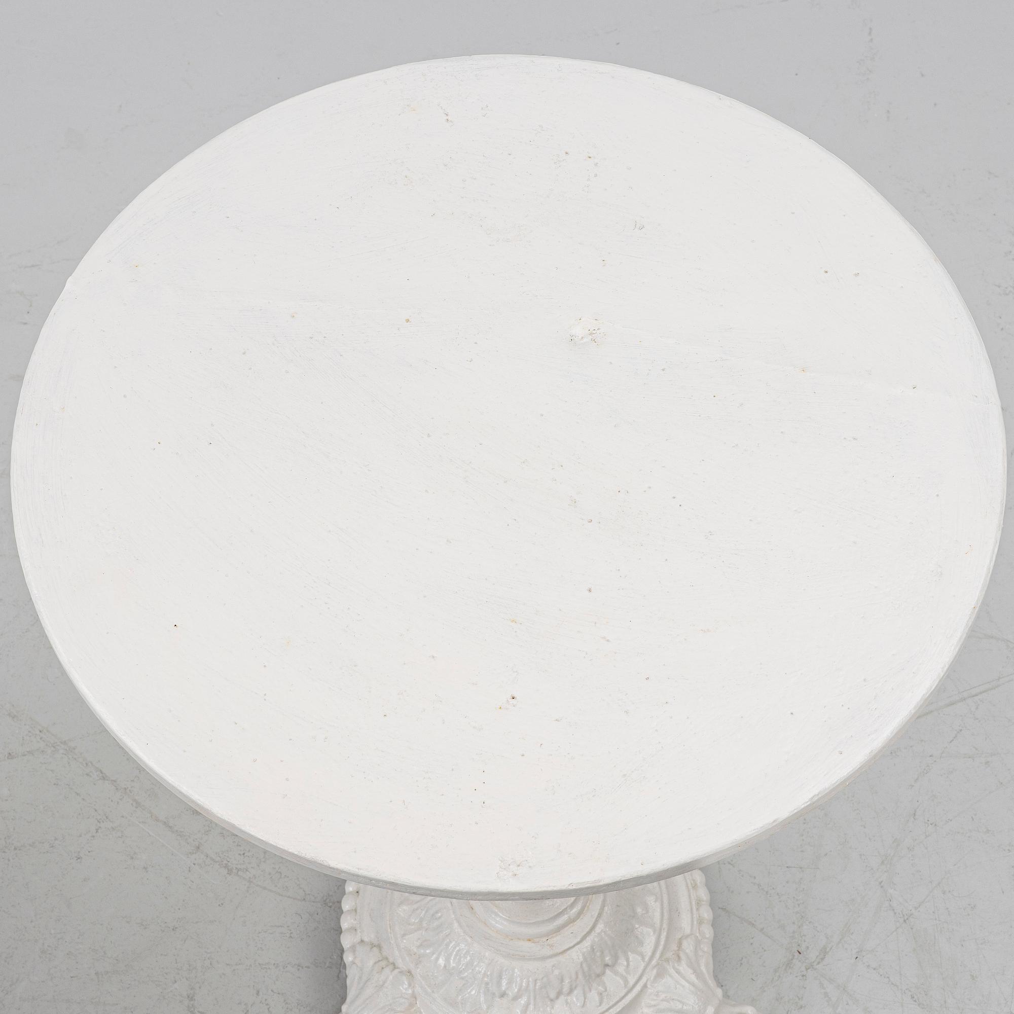 A pair of café tables, around 1900.