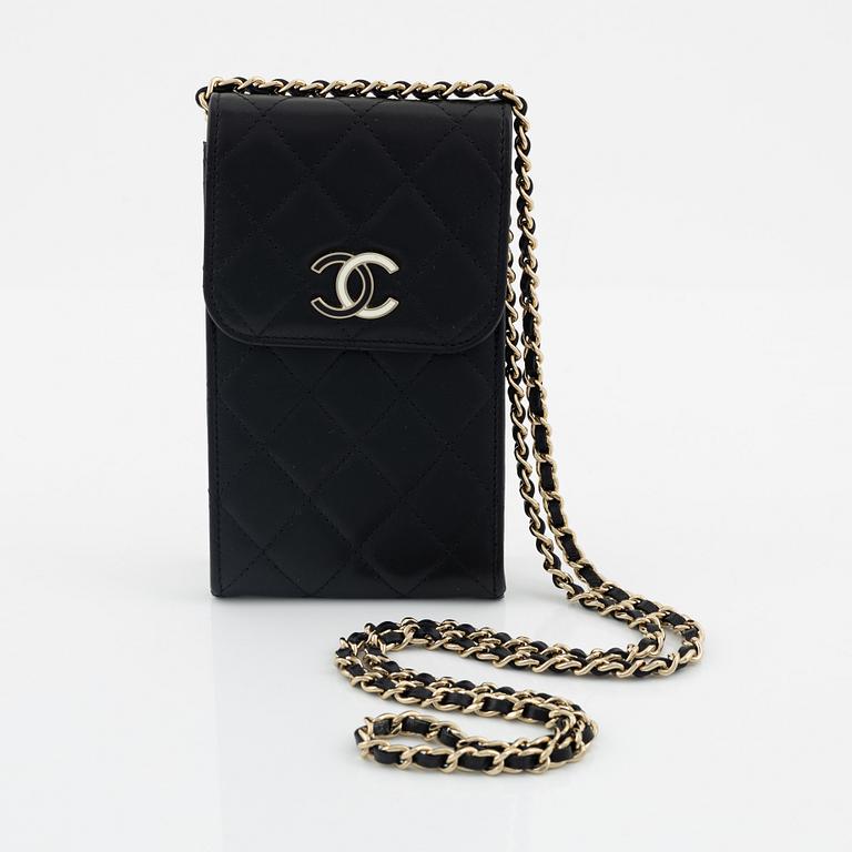 Chanel, a quilted black leather bag, 2021.