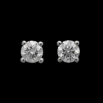 162. A pair of brilliant cut earrings, 0.53 and 0.55 ct.