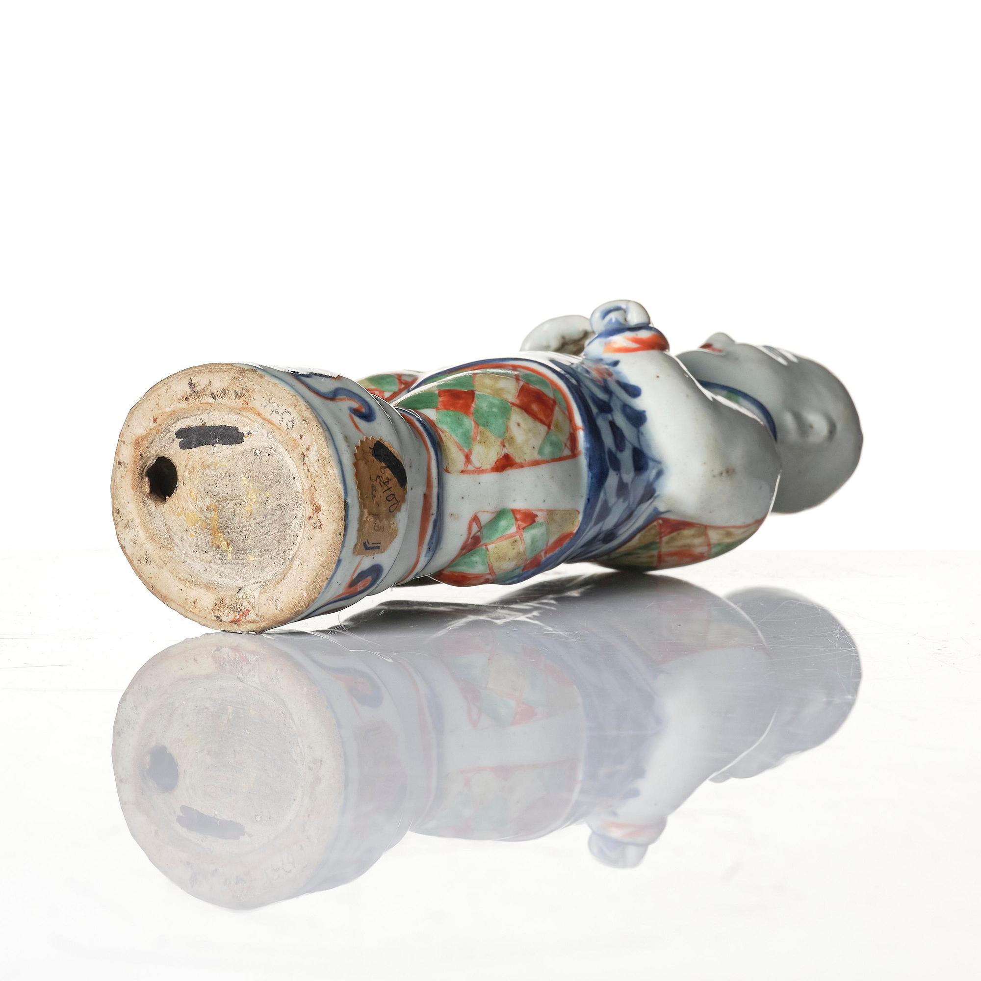 Three Chinese famille verte figures of laughing boys 'Hehe Erxian', 18th century.