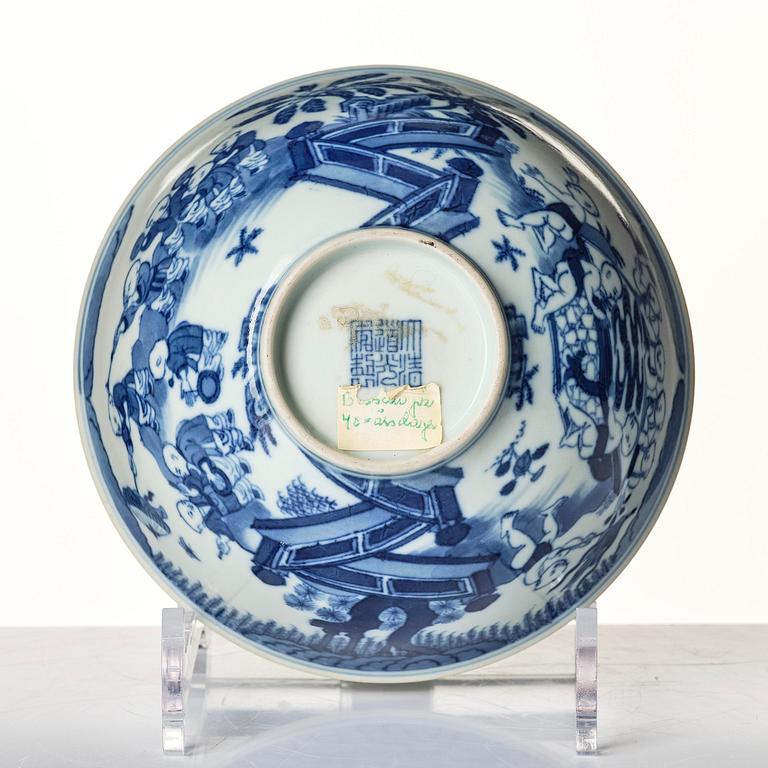 A blue and white 'Yingzi' (Boys at play) bowl, Qing dynasty with a Daouguang mark and of the period (1821-50).