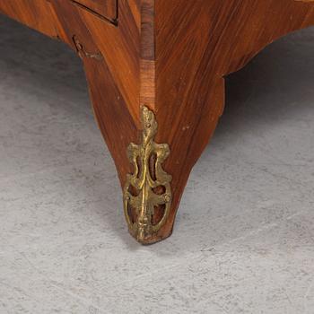 A French Louis XV marquetry and gilt-bronze mounted commode 'Aux bustes de femmes", later part of the 18th century.