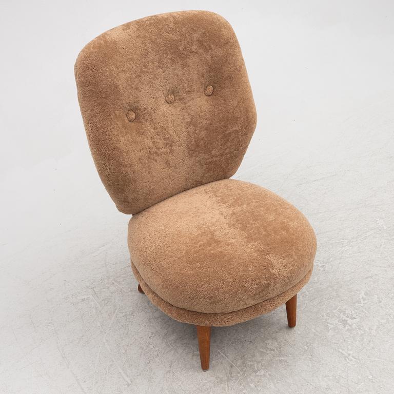 A mid 20th century easy chair,.