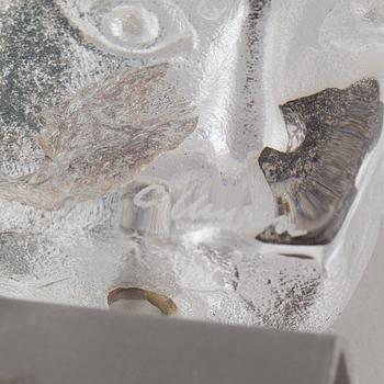 a glass object, signed.