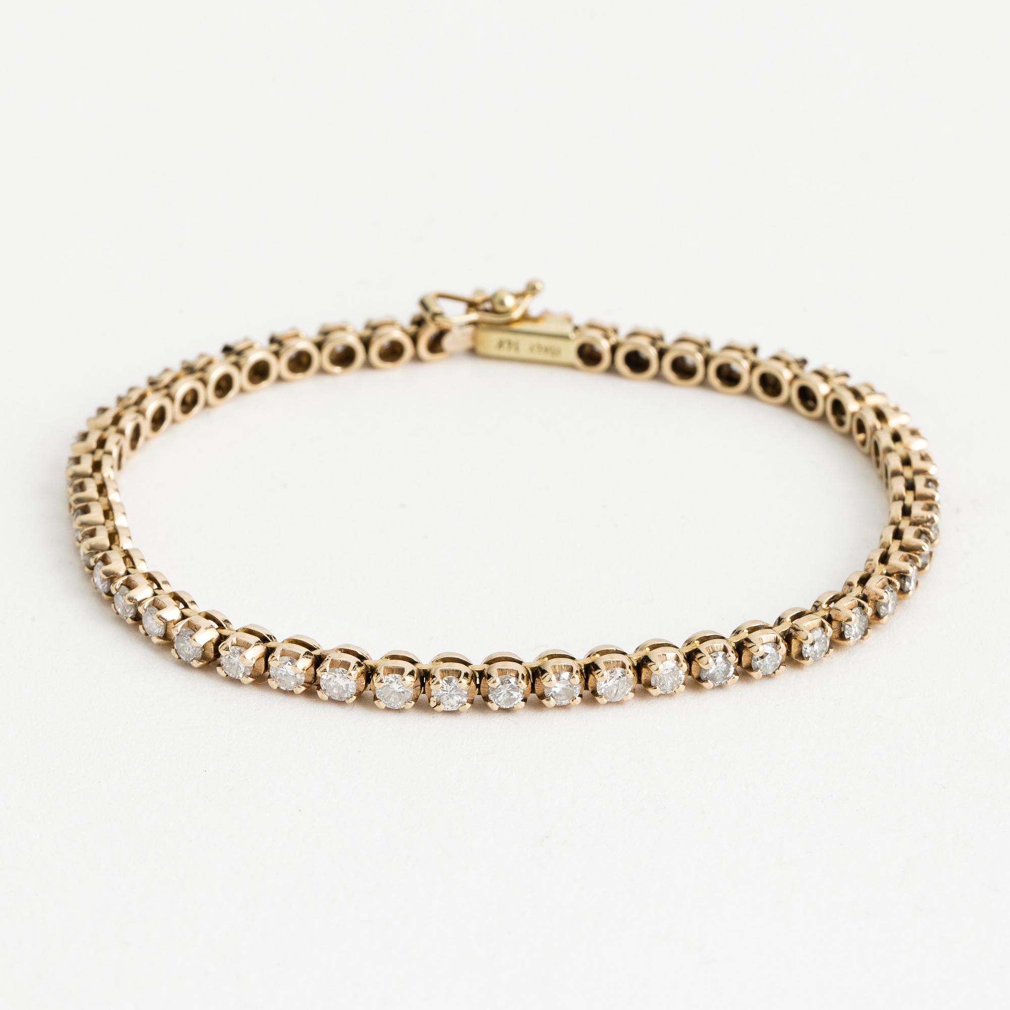 TENNIS BRACELET, 14K gold with 48 diamonds approx. 2.40 cts.
