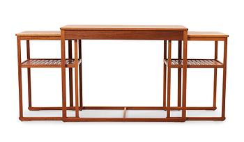 557. A Carl Malmsten teak set of occasional tables.
