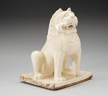 A large white glazed figure of a 'Buddhistic Lion', Qing dynasty, presumably Kangxi (1662-1722).