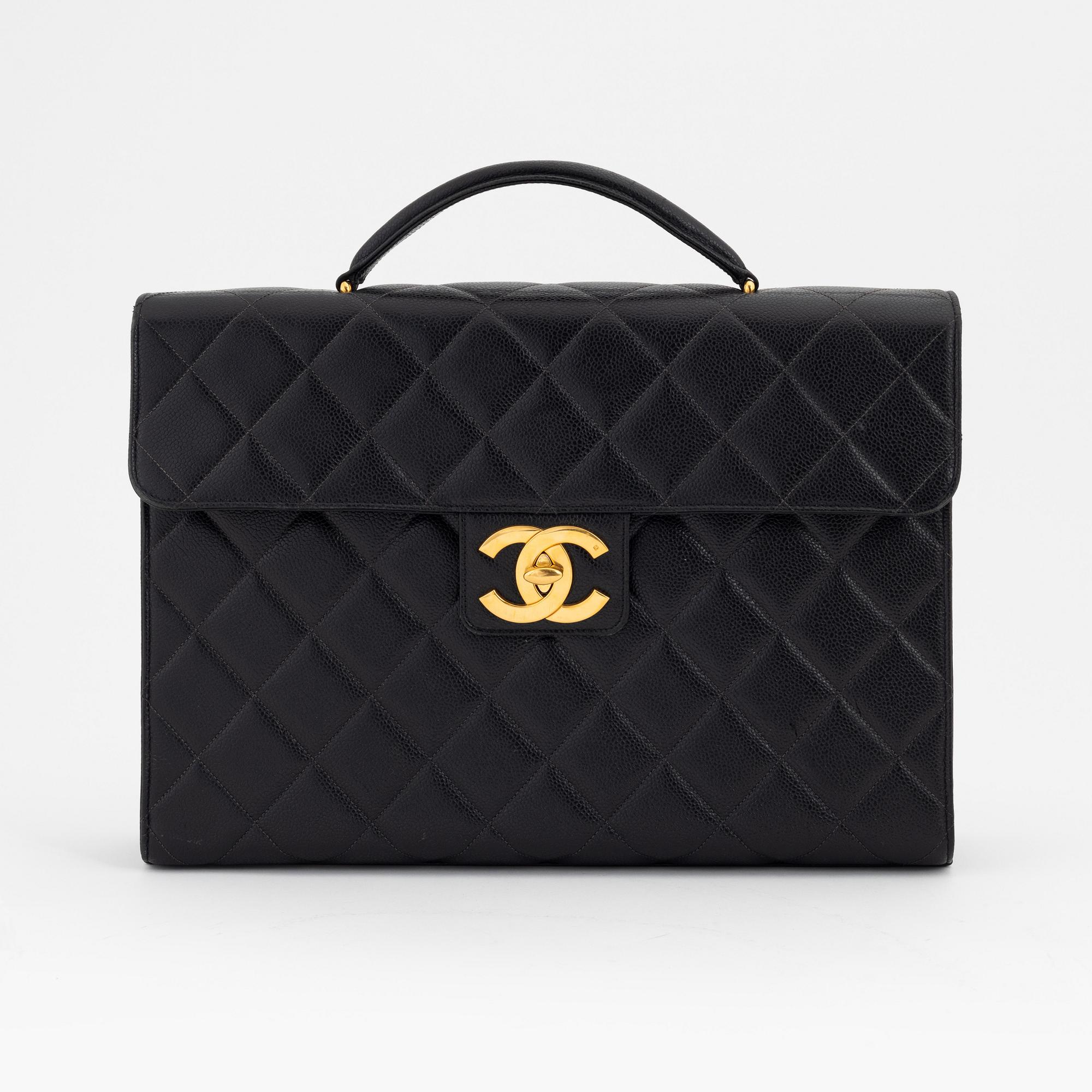 Chanel, a black caviar leather briefcase.