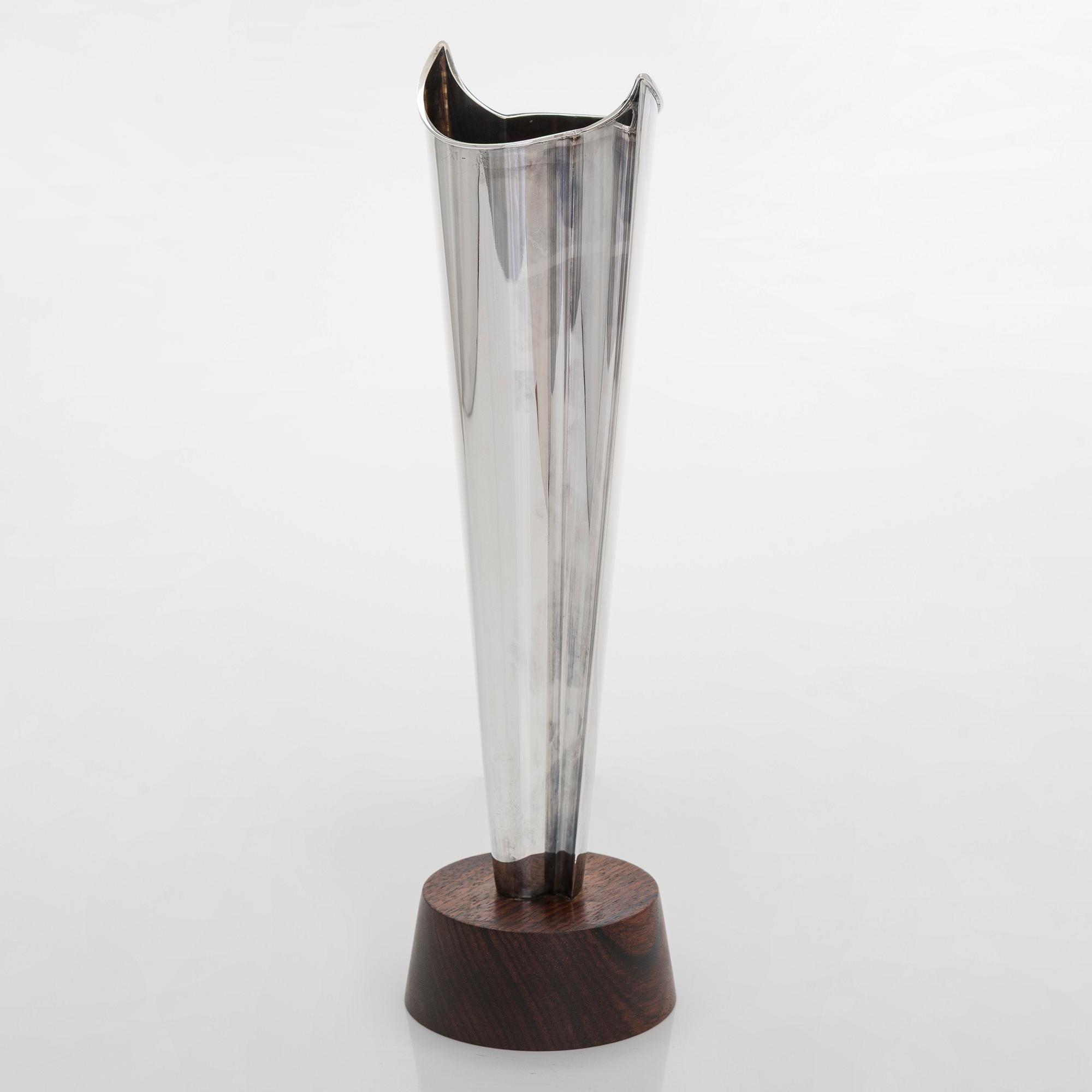 Tapio Wirkkala, a silver TW 228 'Flame' vase on a rosewood base, Kultakeskus, Hämeenlinna 1965.