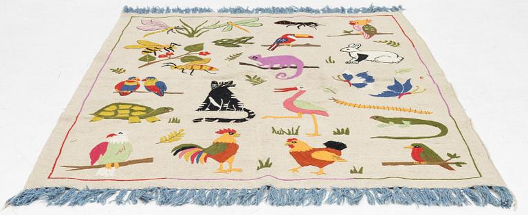 A hand-embroidered Kilim rug, c. 196 x 151 cm.