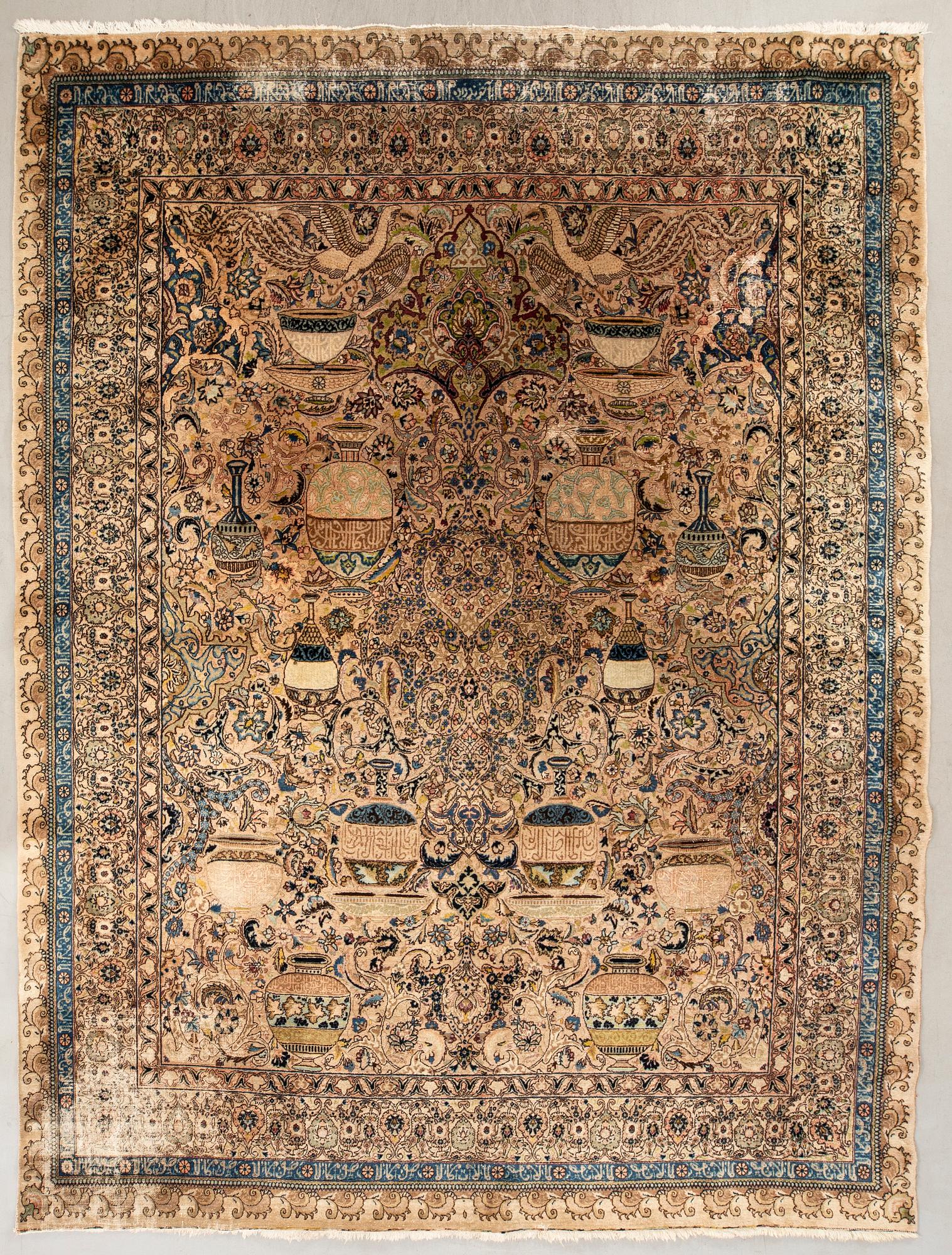 An antique Tabriz carpet, North West Persia, signed Akhondzadeh, c. 394 x 295 cm.