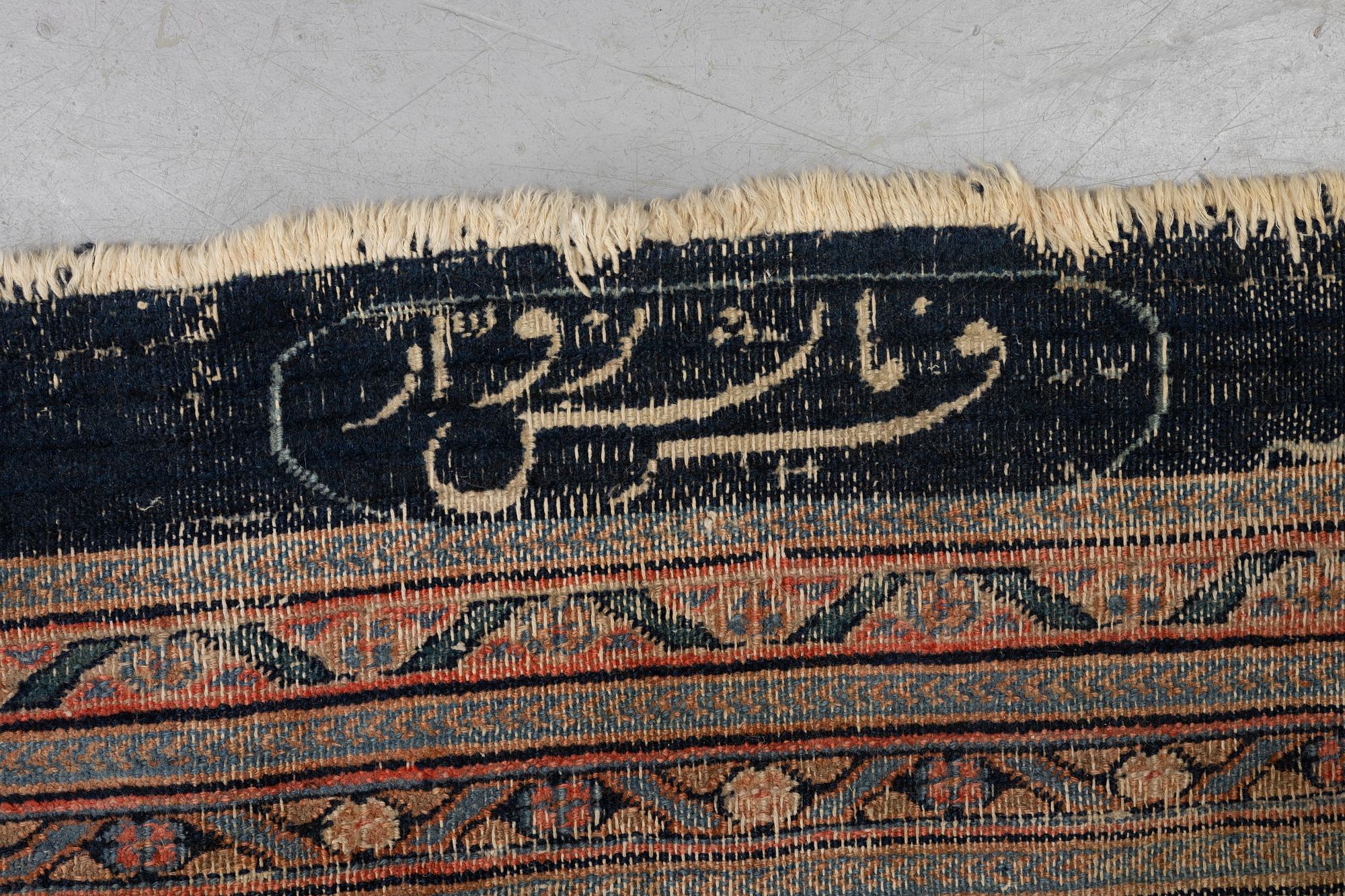 An antique Persian Doroshk carpet, signed, ca 475 x 397 cm.