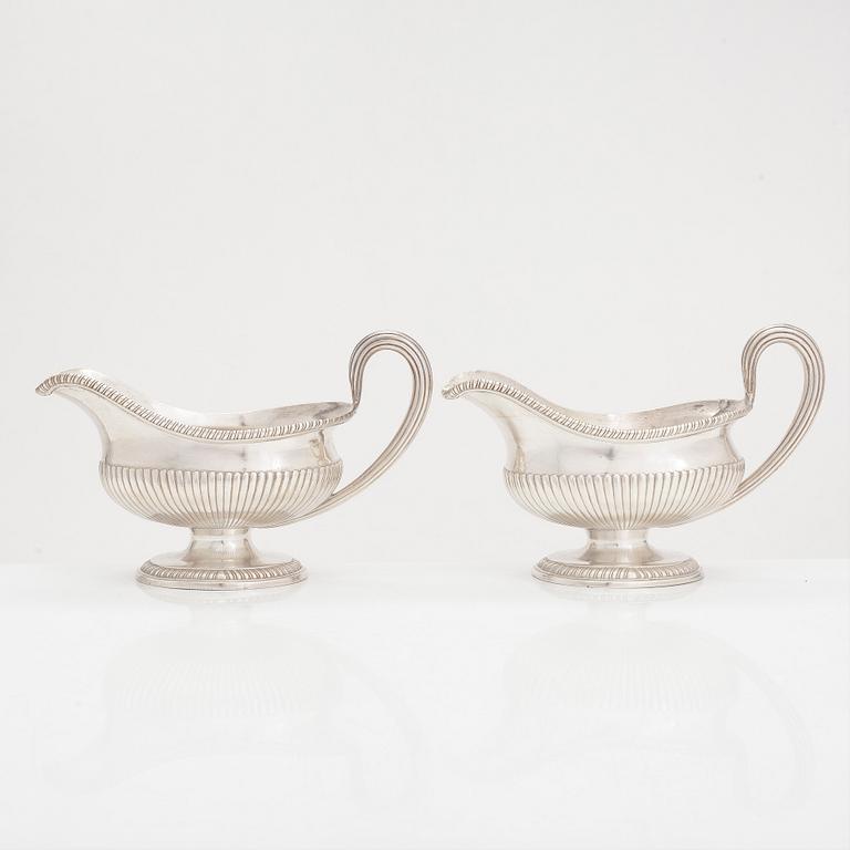 A pair of sterling silver sauce jugs, maker's mark of Andrew Fogelberg, London 1774.