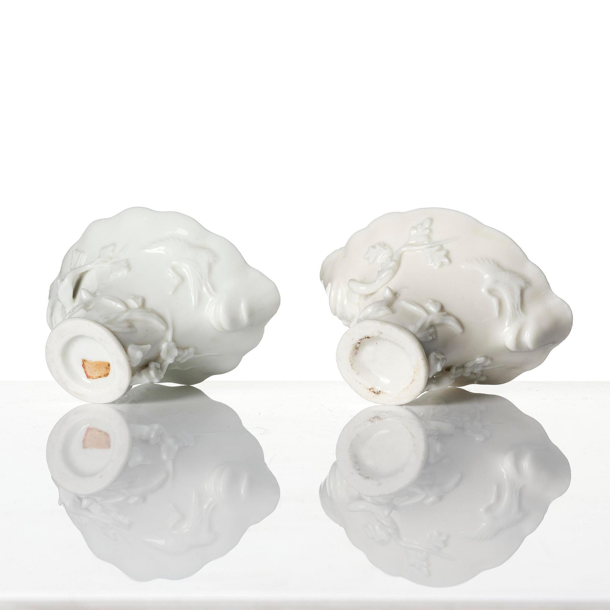 A pair of blanc de chine rhinoceros libation cups, Qing dynasty, Kangxi (1662-1722).