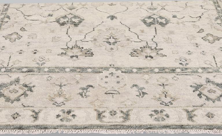 An oriental carpet,  ca 304 x 248 cm.
