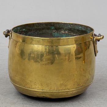 A large 19th century brass cauldron.