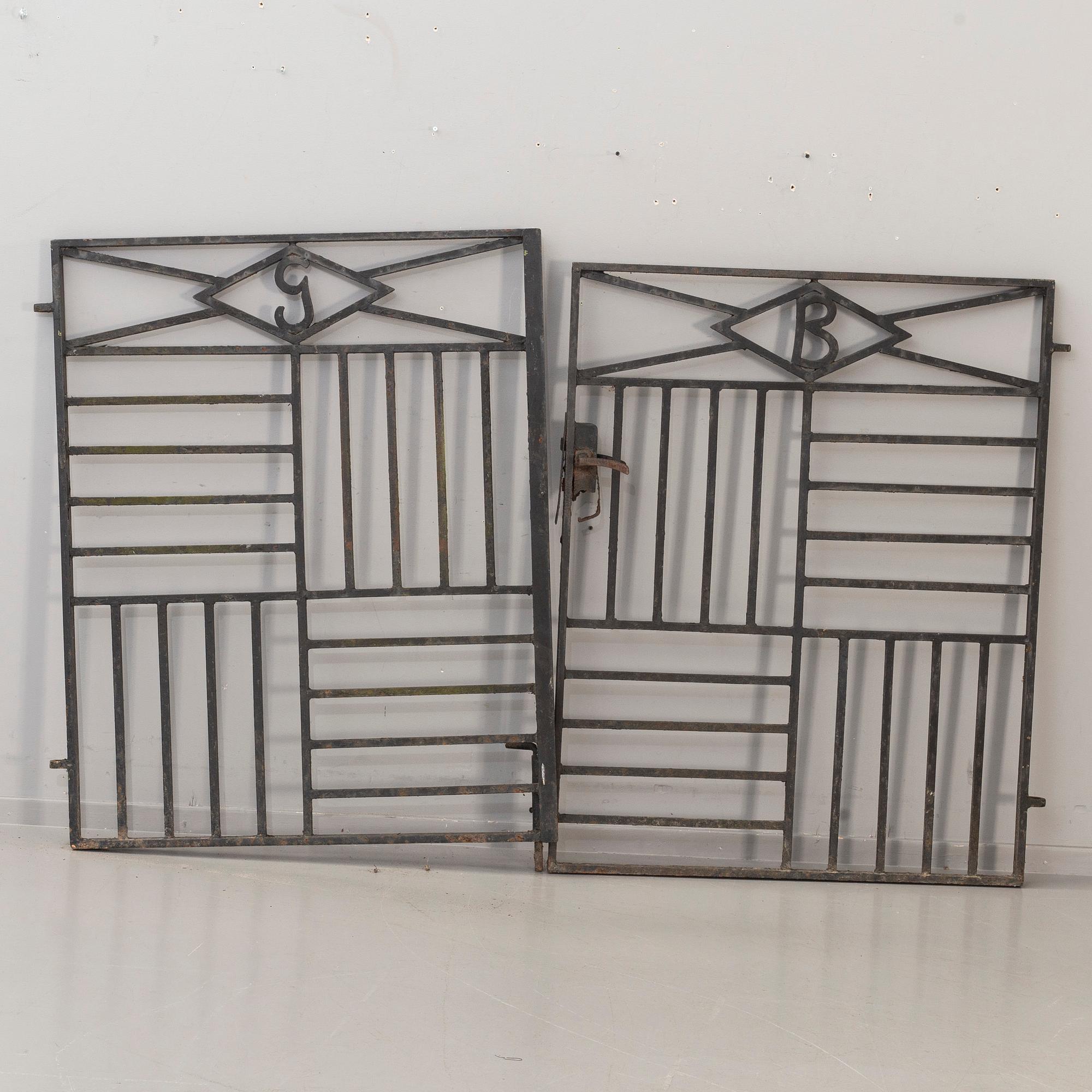 A pair of cast iron gates from the first half of the 20th Century.