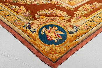 A carpet in savonnerie technique, ca 560 x 429 cm, Louis XVI style.