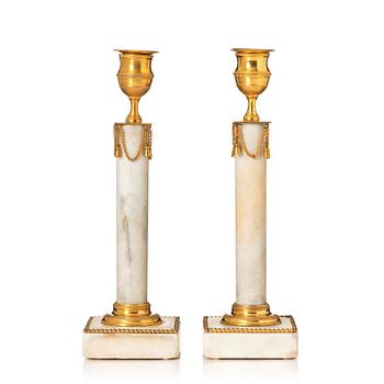 146. A pair of late Gustavian candlesticks.